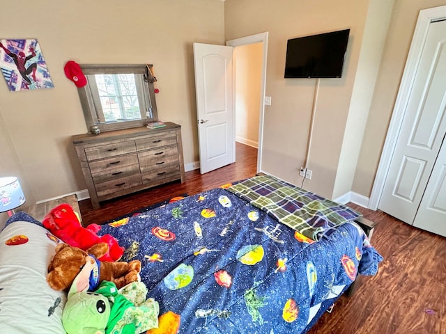 bedroom featuring dark hardwood / wood-style flooring