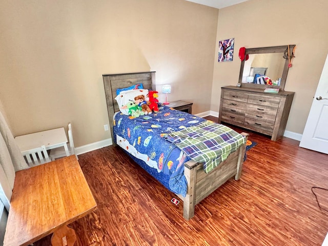 bedroom with hardwood / wood-style floors