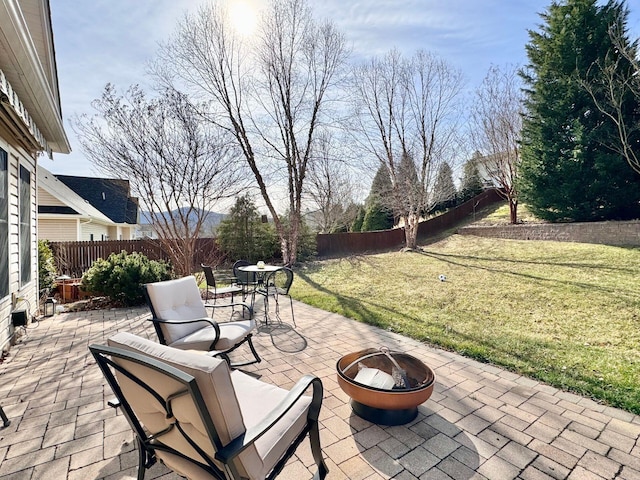 view of patio featuring an outdoor fire pit