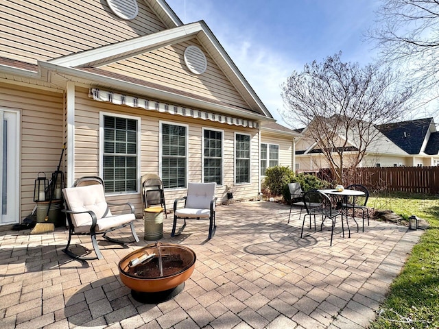 view of patio with a fire pit