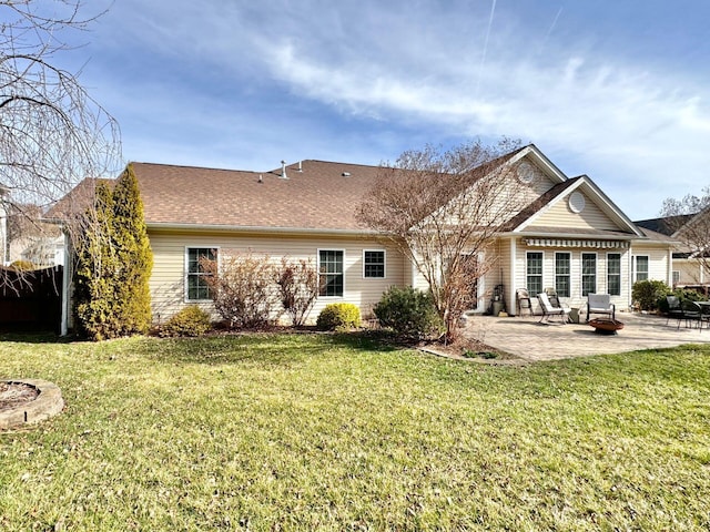 back of property featuring a patio and a lawn