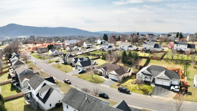 birds eye view of property with a mountain view