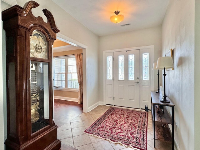 foyer entrance featuring light tile patterned floors