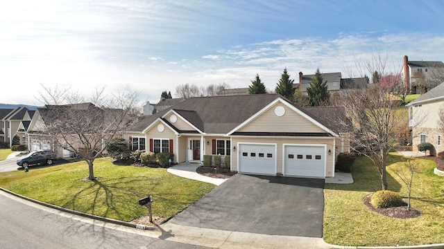 ranch-style home with a garage and a front yard