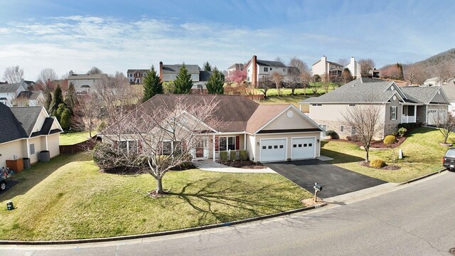 ranch-style home with a front yard and a garage