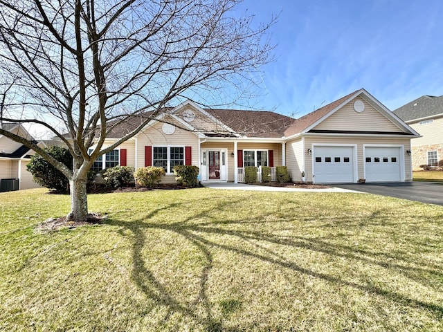 single story home featuring a garage and a front yard