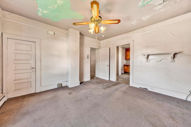 unfurnished room featuring ceiling fan and carpet floors