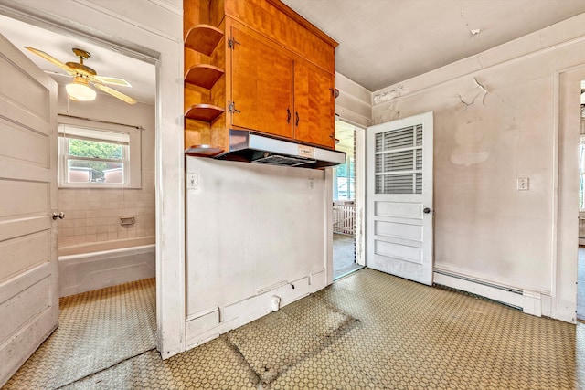 interior space with ceiling fan, a baseboard heating unit, and light tile patterned flooring