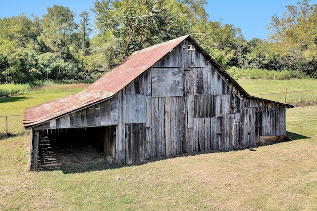 view of outdoor structure featuring a lawn