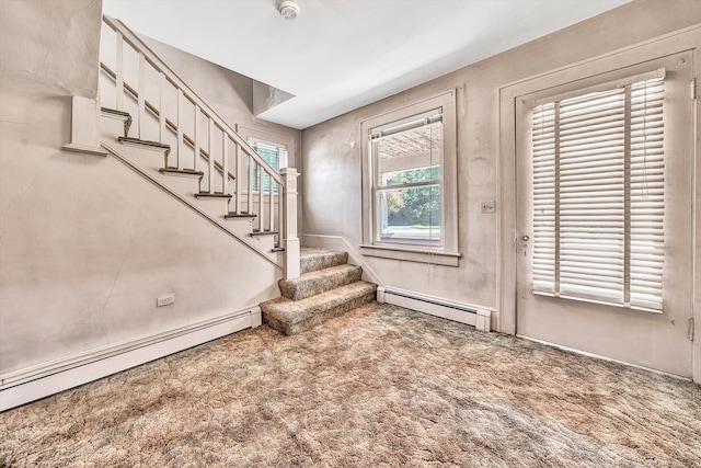 entryway with carpet floors and baseboard heating