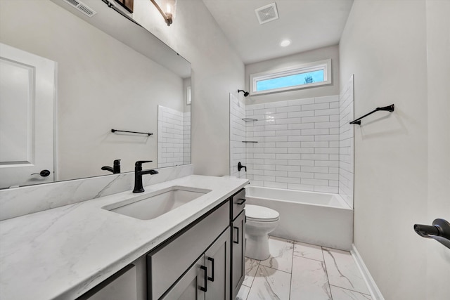 full bathroom with toilet, vanity, and tiled shower / bath