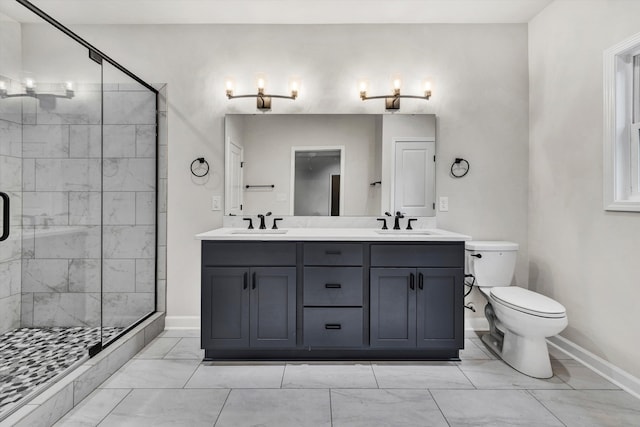 bathroom featuring vanity, toilet, and a shower with shower door