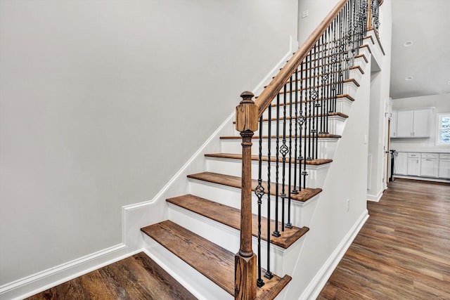 stairway featuring hardwood / wood-style flooring