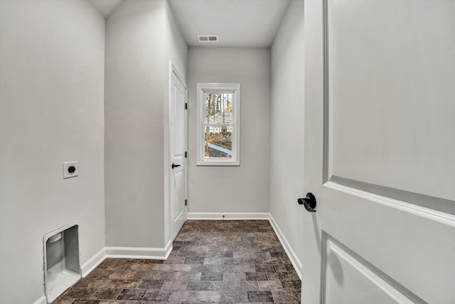 washroom with hookup for an electric dryer