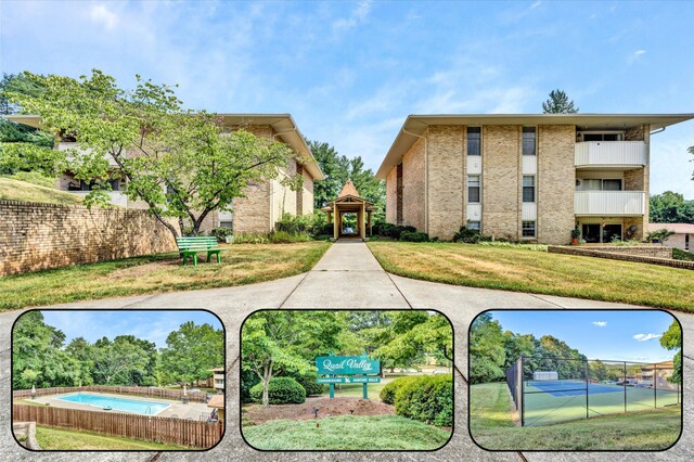 view of home's community with a pool and a yard