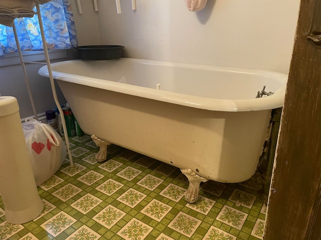 bathroom featuring a tub to relax in