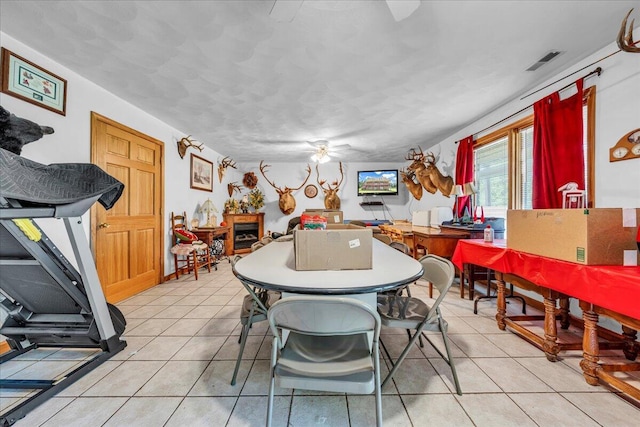 dining space featuring visible vents and light tile patterned flooring