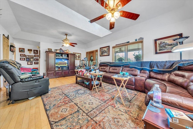 living room featuring light wood-style flooring and ceiling fan