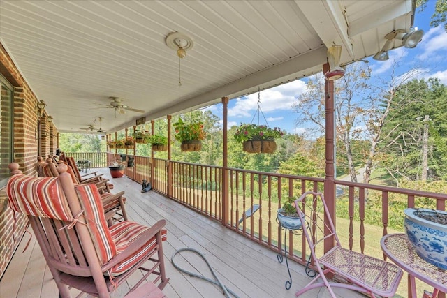 wooden terrace with a ceiling fan