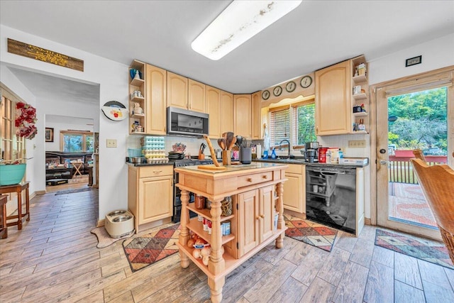 kitchen with range with gas stovetop, light brown cabinets, open shelves, dishwasher, and stainless steel microwave