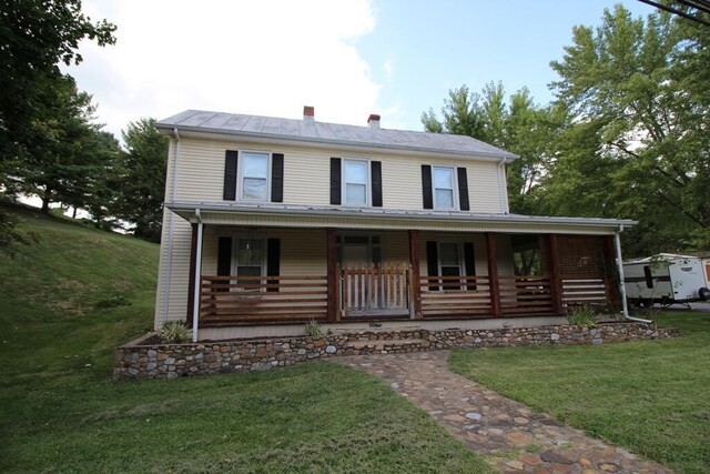 view of front of home featuring a front lawn and a porch