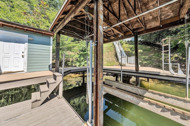 dock area featuring a water view and boat lift