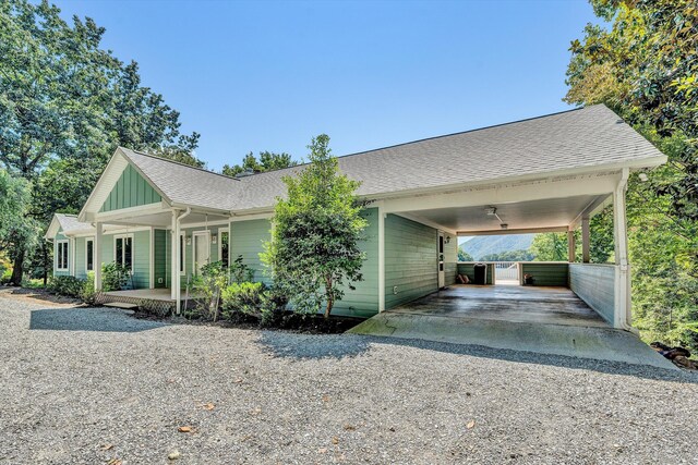 view of front of property featuring a carport