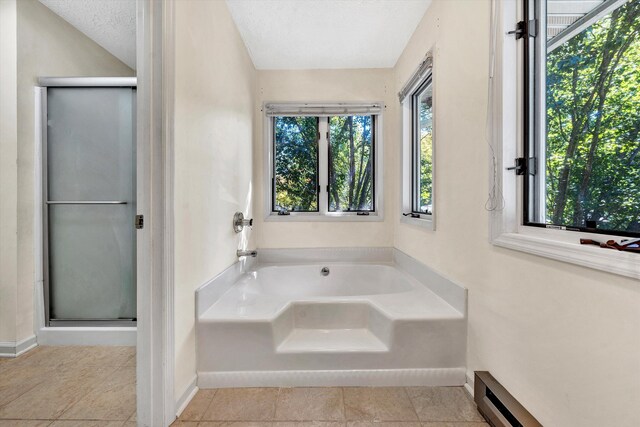 bathroom featuring a textured ceiling, independent shower and bath, a baseboard radiator, and tile patterned flooring