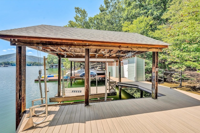 dock area featuring a water and mountain view