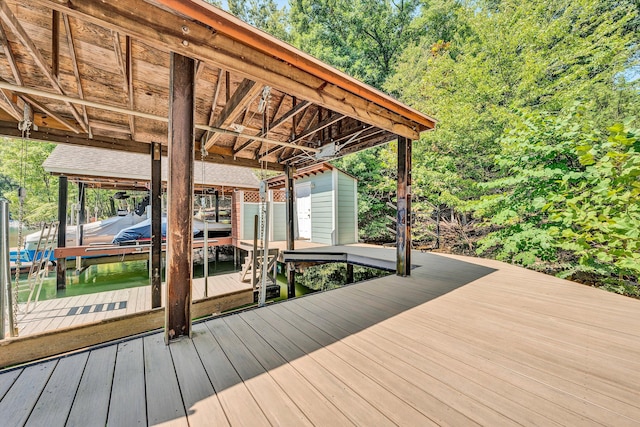 deck with a water view and a boat dock