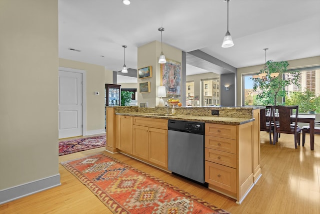 kitchen with dishwasher, light hardwood / wood-style flooring, and decorative light fixtures