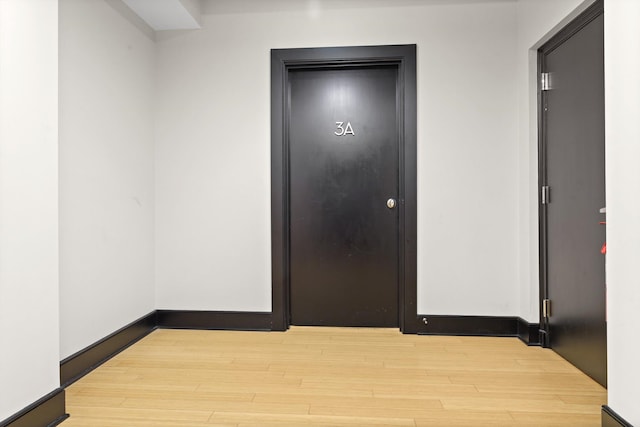 hallway with light wood-type flooring