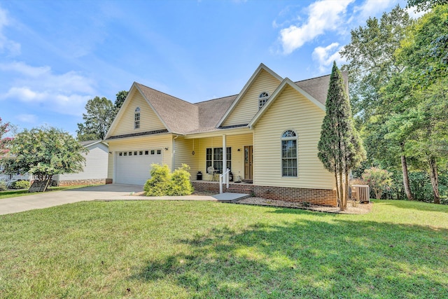 view of front of house featuring a garage, a front lawn, central air condition unit, and covered porch