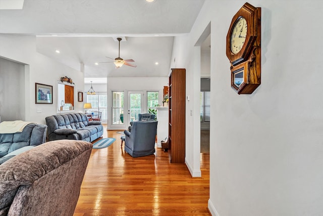 living room featuring light wood-type flooring and ceiling fan