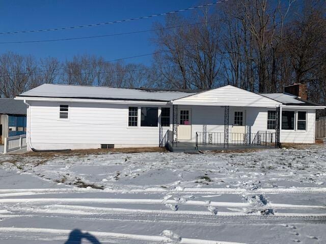 single story home featuring covered porch