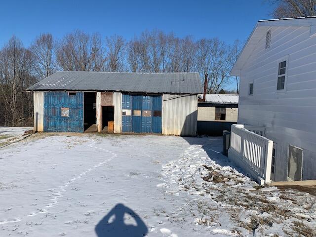 view of snow covered garage