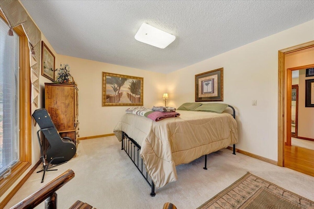 carpeted bedroom with a textured ceiling