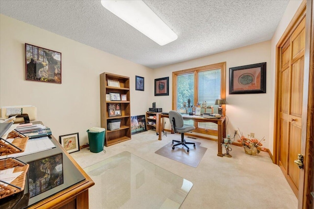 carpeted office with a textured ceiling