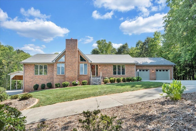 view of front of house with a carport, a garage, and a front lawn