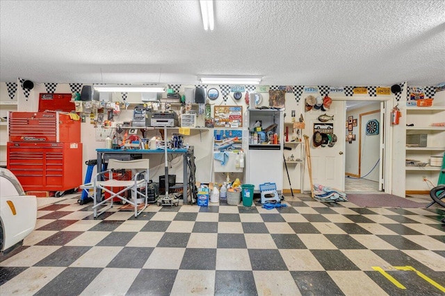 garage with a workshop area