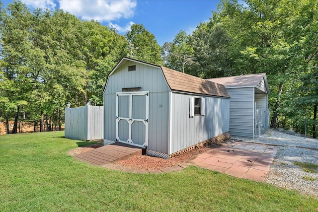 view of outbuilding featuring a yard