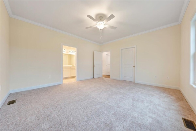 unfurnished bedroom with visible vents, crown molding, and light colored carpet