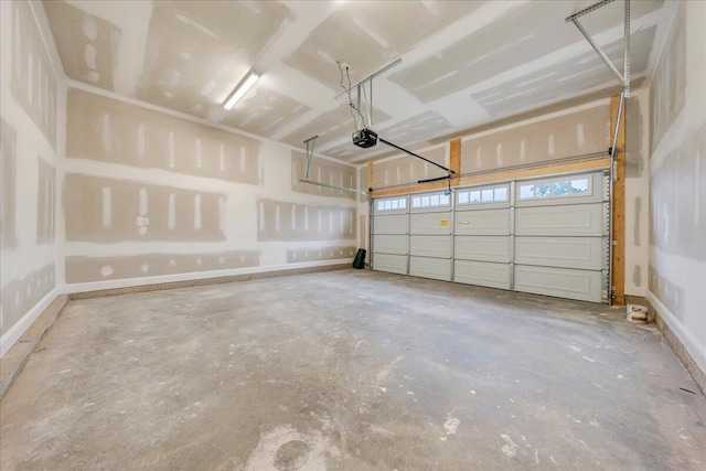 garage featuring baseboards and a garage door opener