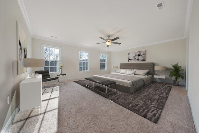 carpeted bedroom featuring ornamental molding and ceiling fan