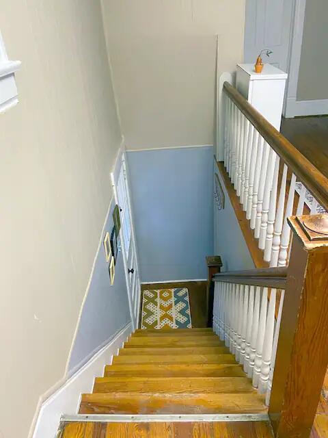 stairway with wood-type flooring