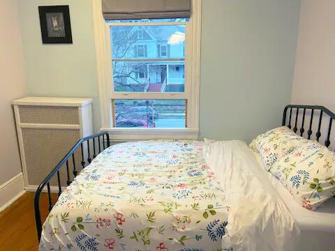 bedroom with wood-type flooring