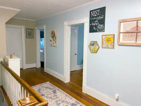 corridor with dark wood-type flooring