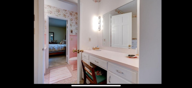 bathroom featuring toilet and vanity