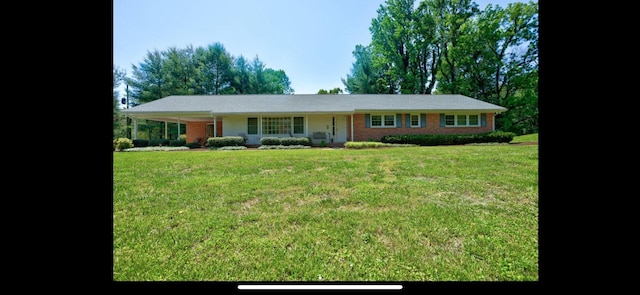 ranch-style home with a front yard and a porch