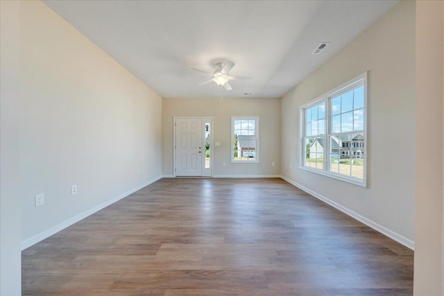 spare room featuring ceiling fan and hardwood / wood-style flooring